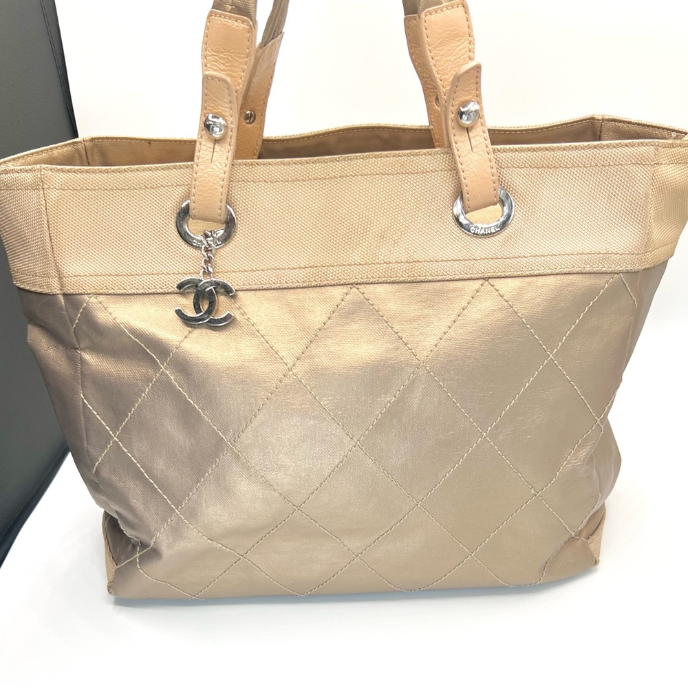 Chanel Paris Biarritz Gold Quilted Coated Canvas Tote with Iconic CC Logo Charm